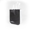 Black tote bag with white handles on a white background