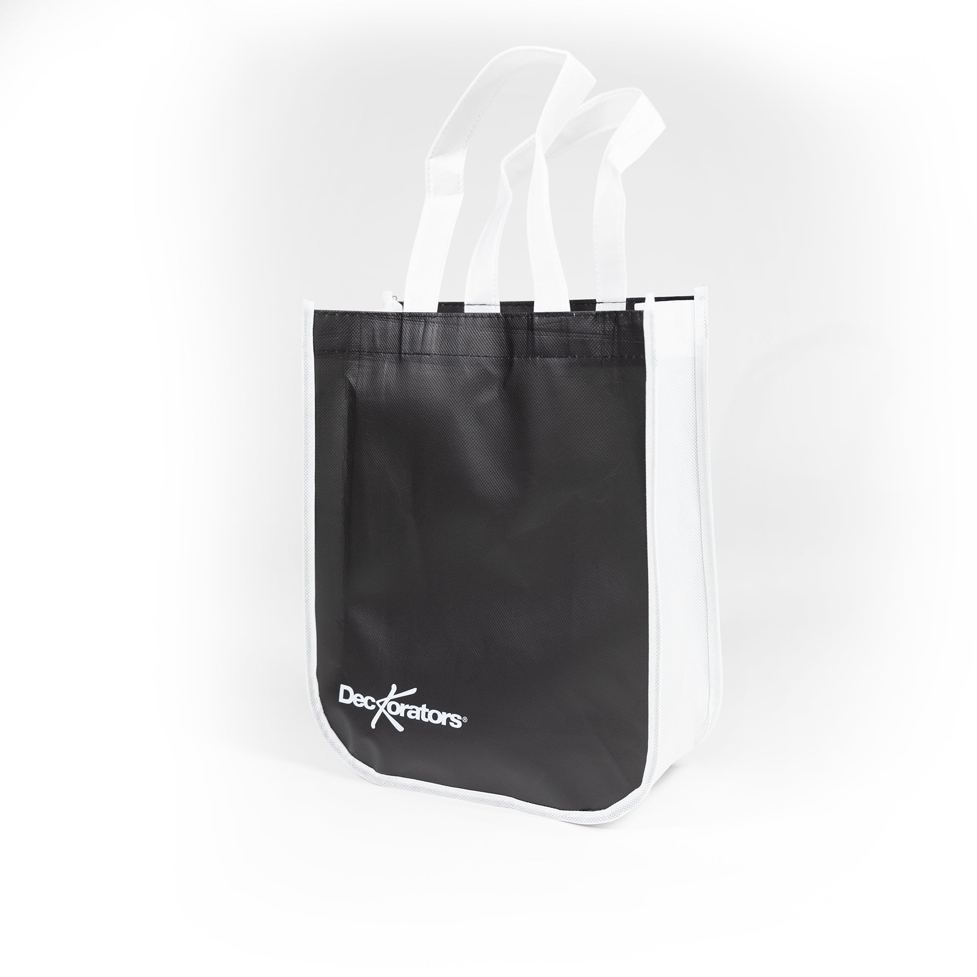Black tote bag with white handles on a white background