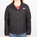 Women's The North Face Black jacket with Deckorators logo on sleeve of jacket